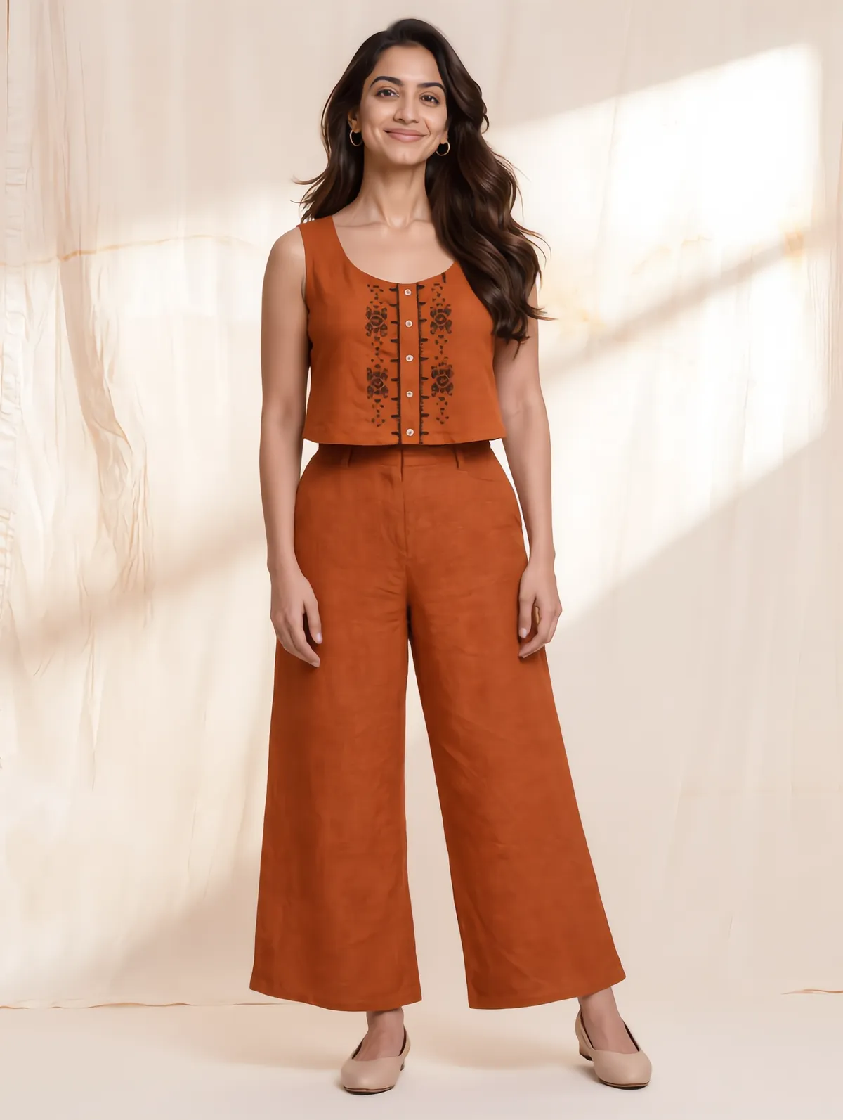 Rust linen cropped top with geometric embroidery and wide-leg trousers